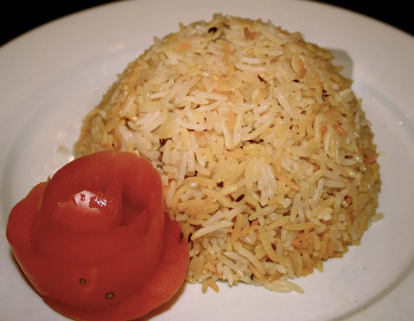 Roz Mandi — Fragrant rice prepared with our traditional mandi seasoning.